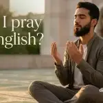 A person making dua with sincerity, asking if making dua in English is allowed in Islam.